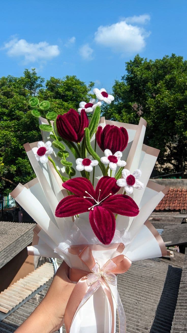 Hands crafting a pipe cleaner flower